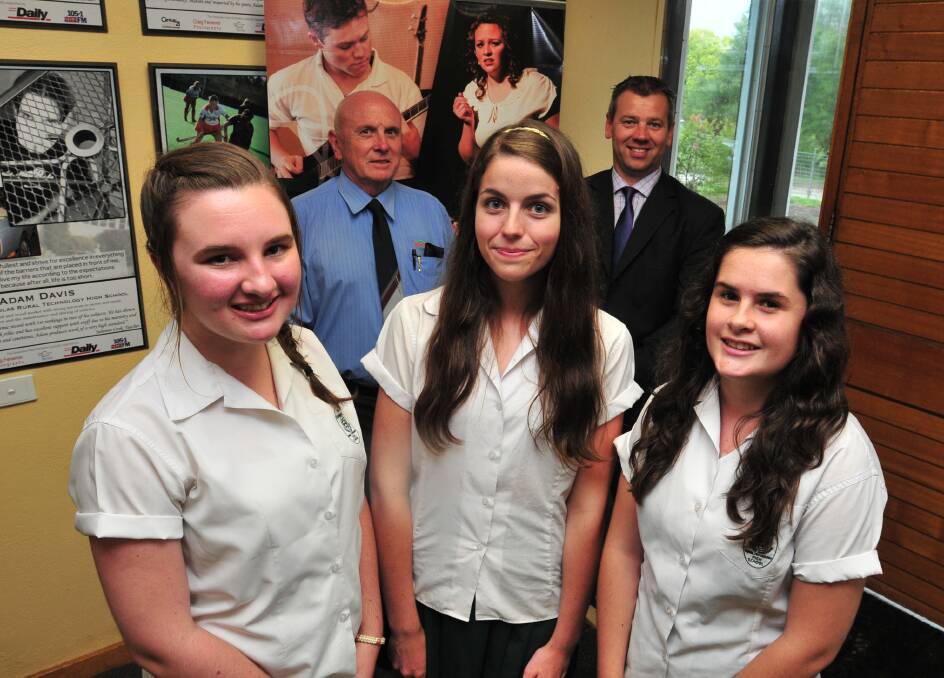 DOWN TO BUSINESS: Orange Business Chamber president Tony Healey (back, left) with Canobolas Rural Technology High School principal Chad Bliss and (front) year 10 students Jacinta Percival, Madison Ewins and Emily Milne. Photo: JUDE KEOGH 	               0219canobolas3