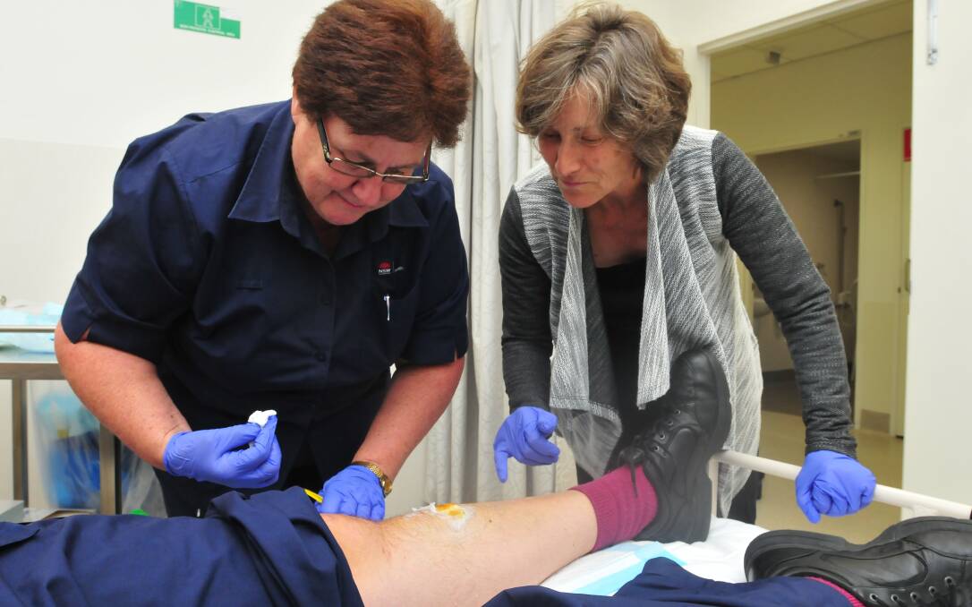SALVE-ATION: Nurse Maureen Templar and Dr Annie Balcomb are part of the team involved in wound care at the Orange hospital and for home visits.
Photo: JUDE KEOGH 0325commnurse4
