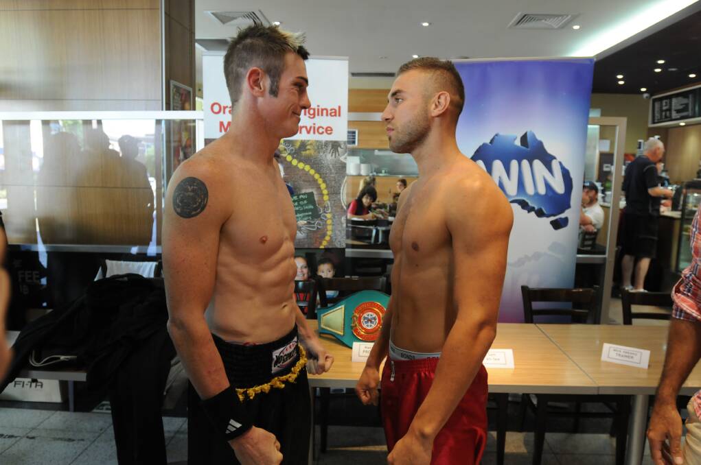 DING DING DING: Shannon King (left) and Sam Ah-See size each other up at yesterday’s weigh-in for the Australian National Boxing Federation super-welterweight title set to be held tonight at the Orange Function Centre. Photo: STEVE GOSCH                                                                         0220sgbox4
