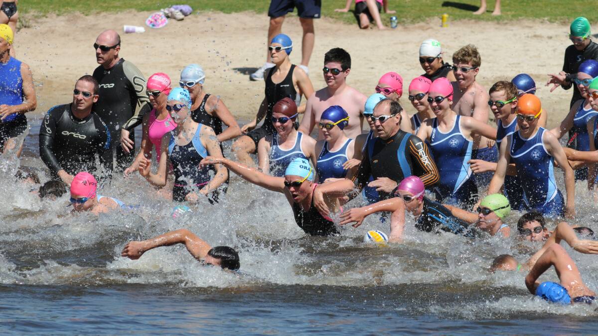 DIVE IN: Competitors take to the water for the  first round of the Central West Inter-Club Triathlon Series. 								1123sgtri2