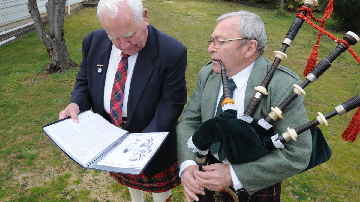SCOTTISH FUN: Chief Bob Lambert and Official Piper David Howell of the Orange and District Scottish Association and Burns Club are looking forward to the upcoming Tartan Ball. Photo: STEVE GOSCH 0717sgtartan1

