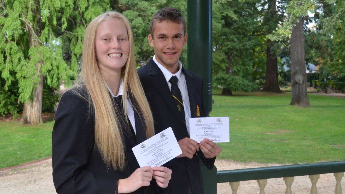 ROYAL OCCASION: Orange High School captains Meaghan Kempson and Trent French with their offical invitations. Photo: ALEXANDRA KING 0415akohs1
