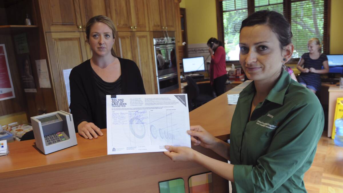 BAD MEDICINE: Colour City Medical practice receptionist Tasha Cregan and office manager Jenny Chambers have signed a petition against changes to Medicare rebates. Photo: MARK LOGAN 			              0114mlgp1