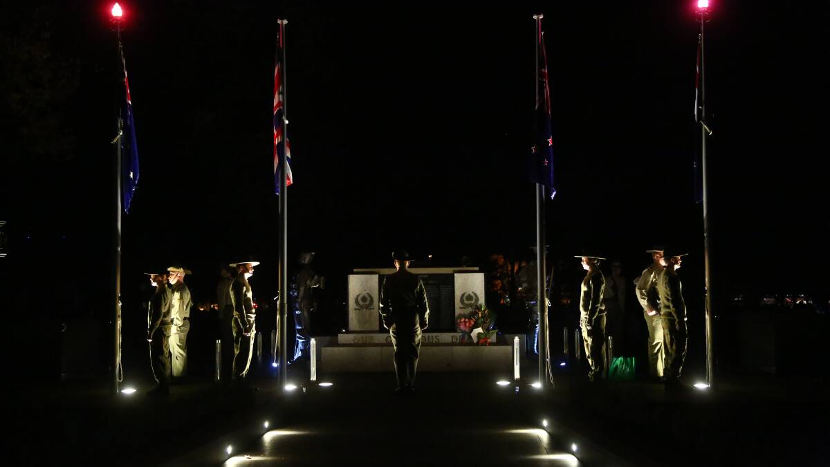 MOVING: The Anzac Day dawn service gets underway at the revamped cenotaph in Robertson Park. Photo: PHIL BLATCH 0425pbdawn2