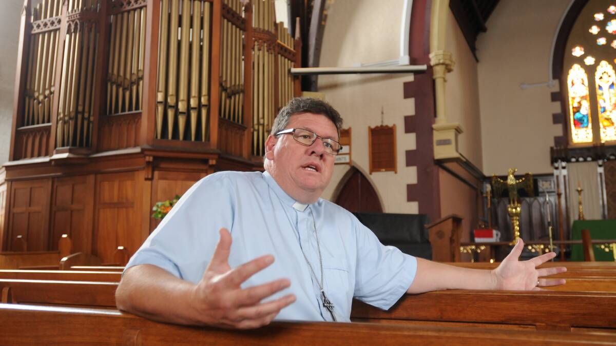 A BROAD APPROACH: The new rector of Holy Trinity Anglican Church, the Reverend Malcom Dunnett says he is keen to take a new approach to the ministery as he looks to serve the parish and the wider community. Photo: STEVE GOSCH 1104sgrector2