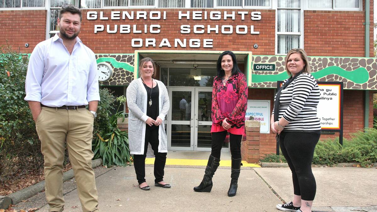 BACK TO SCHOOL: Glenroi Heights Public School staff members Dylan Kearns, Naomii Barrett, Nicole Stevens and Amanda McLean are among eight staff who attended the school as students and are using their experiences growing up in Glenroi to help a new generation of students. Photo: STEVE GOSCH 0429sgteachers2