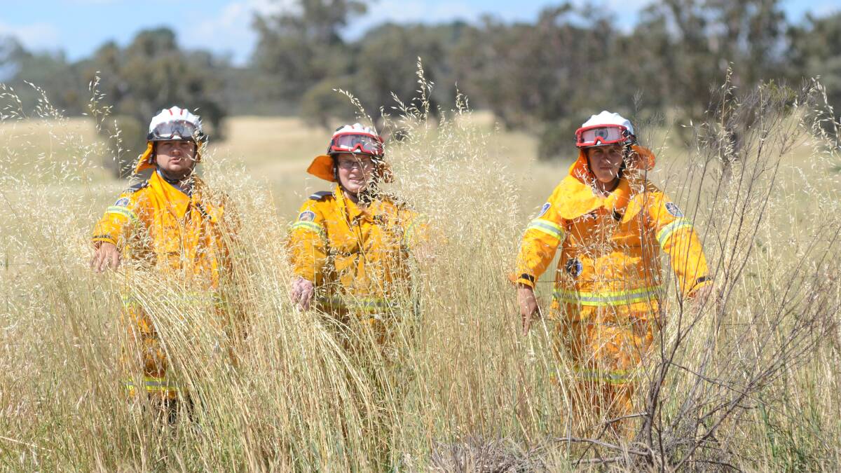 FIRE DANGER: Rural firefighters Mark Gray, Mel Beaumont and Jacob Perryment warn people to adhere to strict fire ban conditions in Orange this weekend. Photo: MARK LOGAN 1121mlfiries2