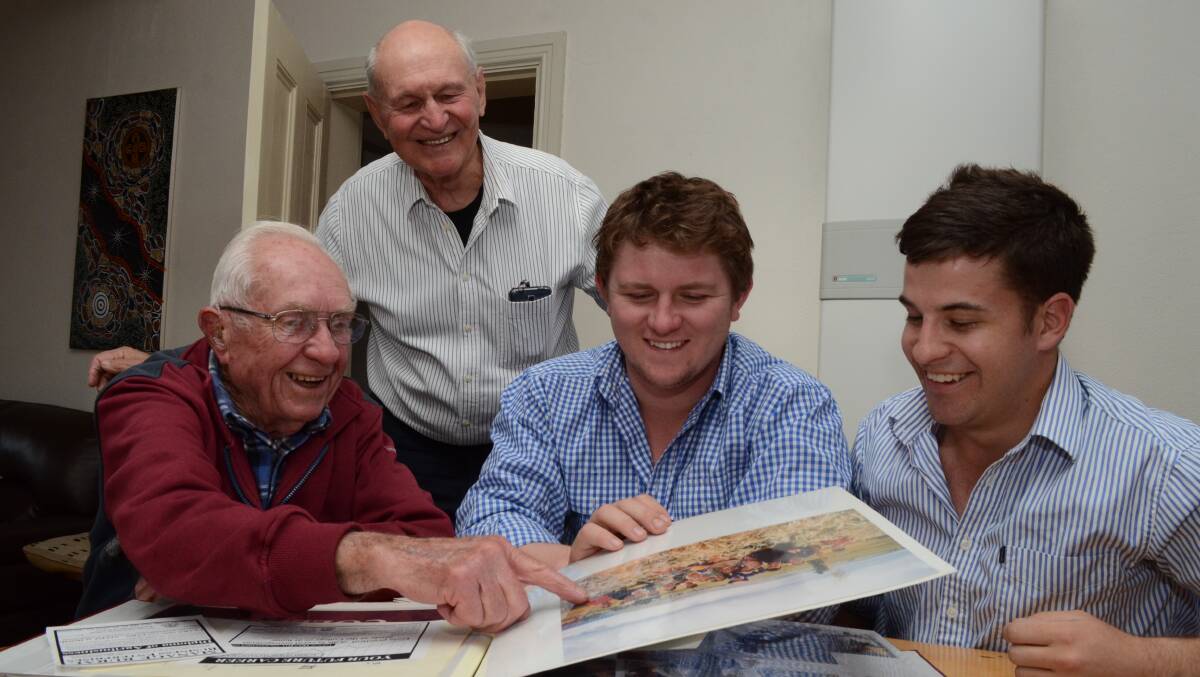 WALK DOWN MEMORY LANE: Original Orange Agricultural College staff members Barry Smart and Ed Henry with current CSU students Nick Ball and Mark McLennan reminisce on the campus' colourful history. Photo: JUDE KEOGH 0925agcollege1
