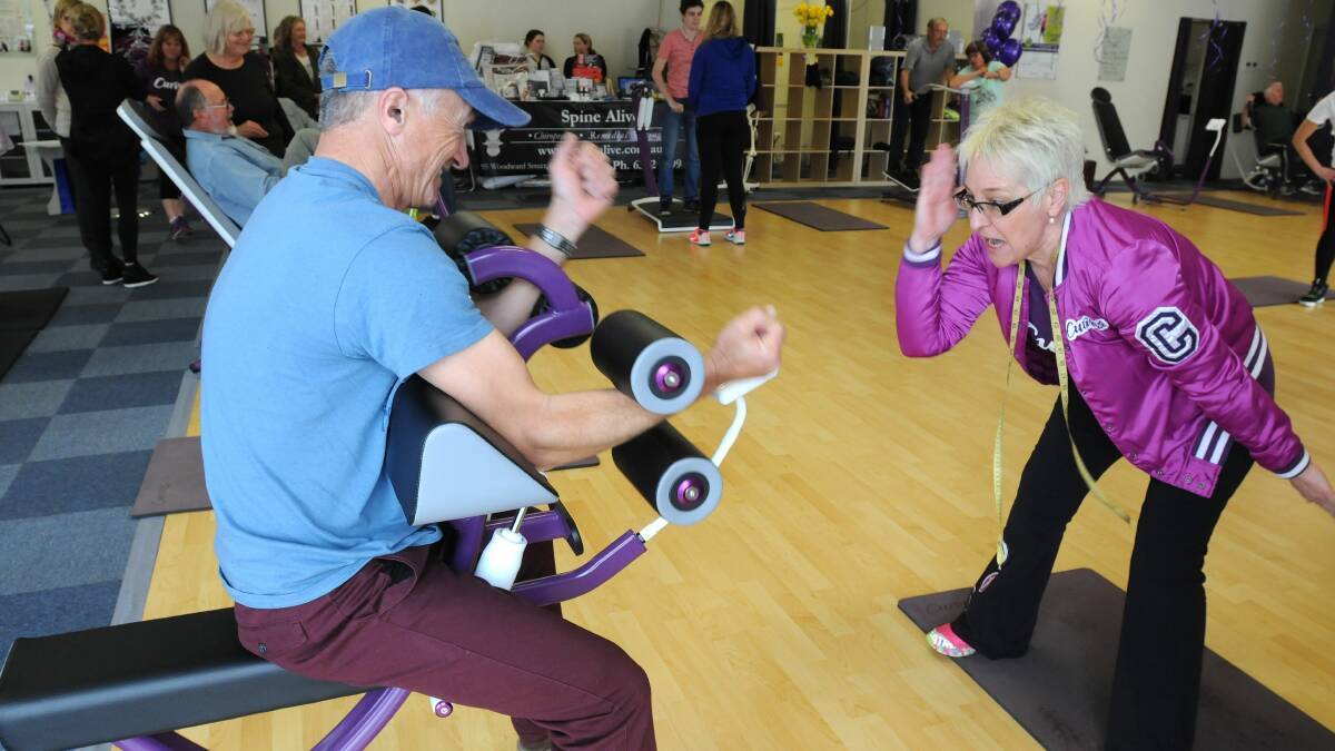 WORK IT: Dean Sutherland gets advice from Curves circuit coach Janelle Witschi at a special trial for men at the gym’s open day on Saturday.  Photo: STEVE GOSCH										    0816sgcurves1