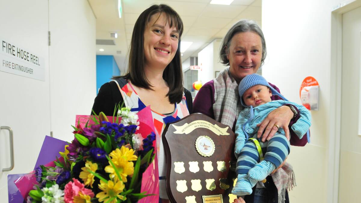 MIDWIFE OF THE YEAR: New mother Anna Currall returned to Orange hospital’s maternity unit to announce that the midwife who attended her birth, Roslyn Webster, was Orange’s 2014 Midwife of the Year. Photo: LUKE SCHUYLER                                      0505midwife
