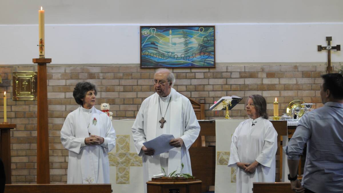 CHRISTIANS CELEBRATE: The Reverend Anne and the Reverend Garry Neville and lay minister Wendy Davidson presiding at yesterday’s Easter Sunday service at St Barnabas Anglican Church in Orange.  Photo: STEVE GOSCH 0420sgeaster3