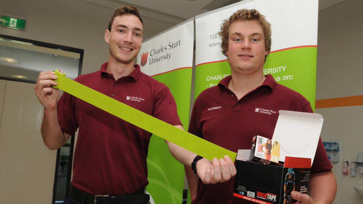 RELIEF IN SIGHT: CSU fourth-year physiotherapy students Liam Abbey and Jack Archer. Photo: JUDE KEOGH   0210physio2
