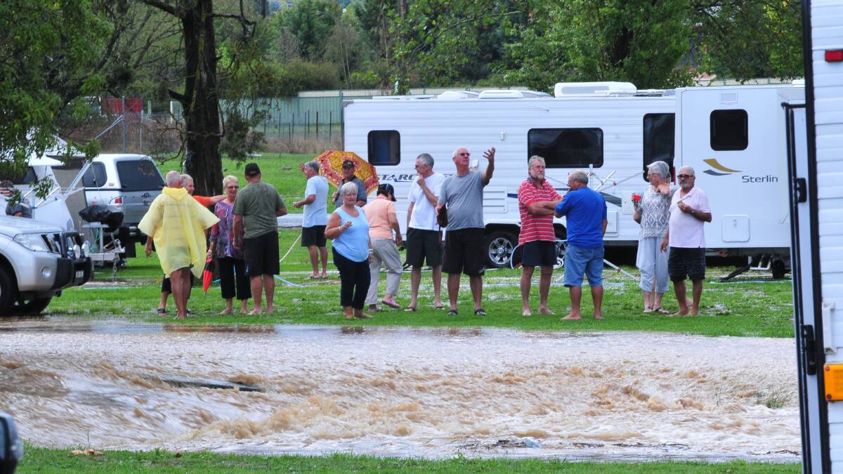 WASH OUT: (above) A group of caravanners staying at the Orange Showground for a veterans' golf tournament had just set up when yesterday’s storm struck.
Photos: JUDE KEOGH 0307showgrd9
