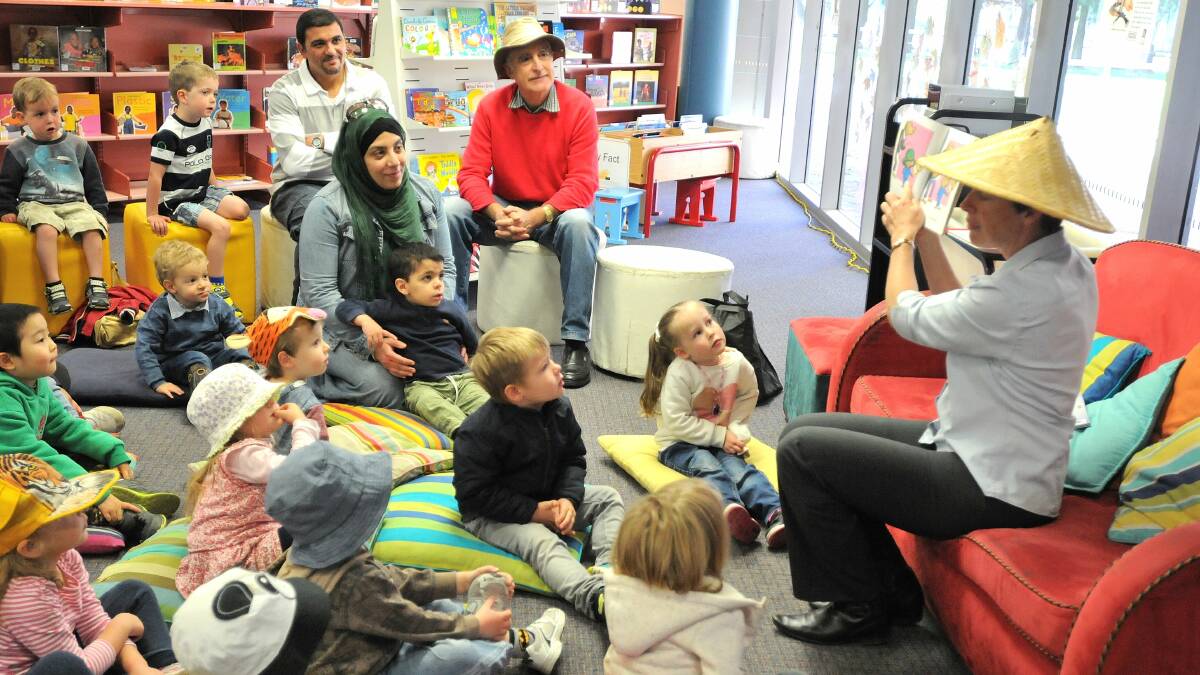 STORYTIME: Children dressed up in their favourite hats as Fiona Hawke read I Got This Hat by Jol and Kate Temple for National Simultaneous Storytime at Orange City Library on yesterday. Photo: STEVE GOSCH 0525sgstory5