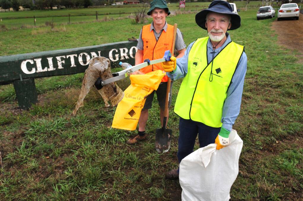 PITCH IN: Peter West and Denis Marsh are asking Orange residents to roll up their sleeves and help out on Clean Up Australia Day on Sunday. Photo: STEVE GOSCH 									                                 0228sgcleanup1