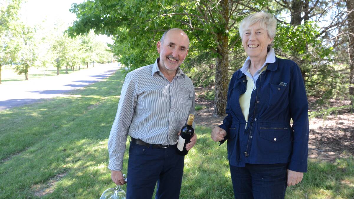 WANDER AND WINE: Charles Sturt University winery marketing manager Justin Byrne and Summer Hill Creekcare’s Cilla Kinross talk about the upcoming riverside walk on Sunday. Photo: JUDE KEOGH 	               1103CSUcreekcare5
