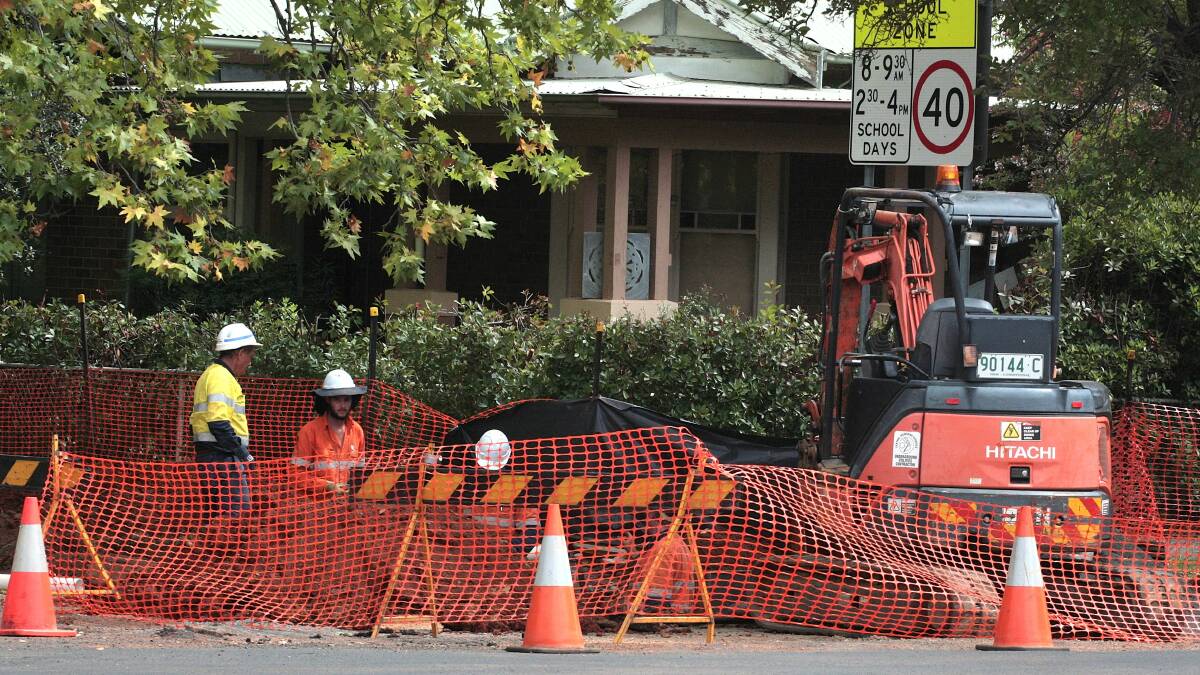 CONSTRUCTION STARTS: Subcontractors for the NBN working on Telstra pit replacements. Photo: STEVE GOSCH 