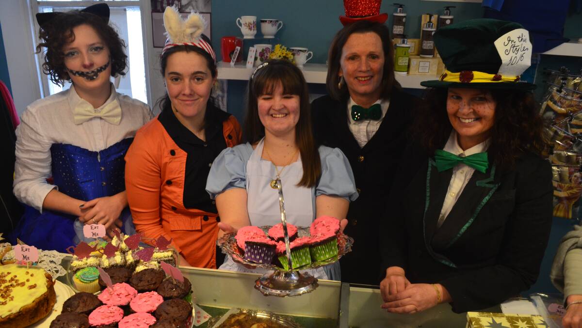 EAT ME: Red Cross Shop volunteers Morgan Collens, Maxine O’Neil, Holly Schneider, Julie Fisher and Diana Weston with some of the cakes for sale at the store’s Big Cake Bake on Saturday. Photo: ALEXANDRA KING  0816akcakebake
