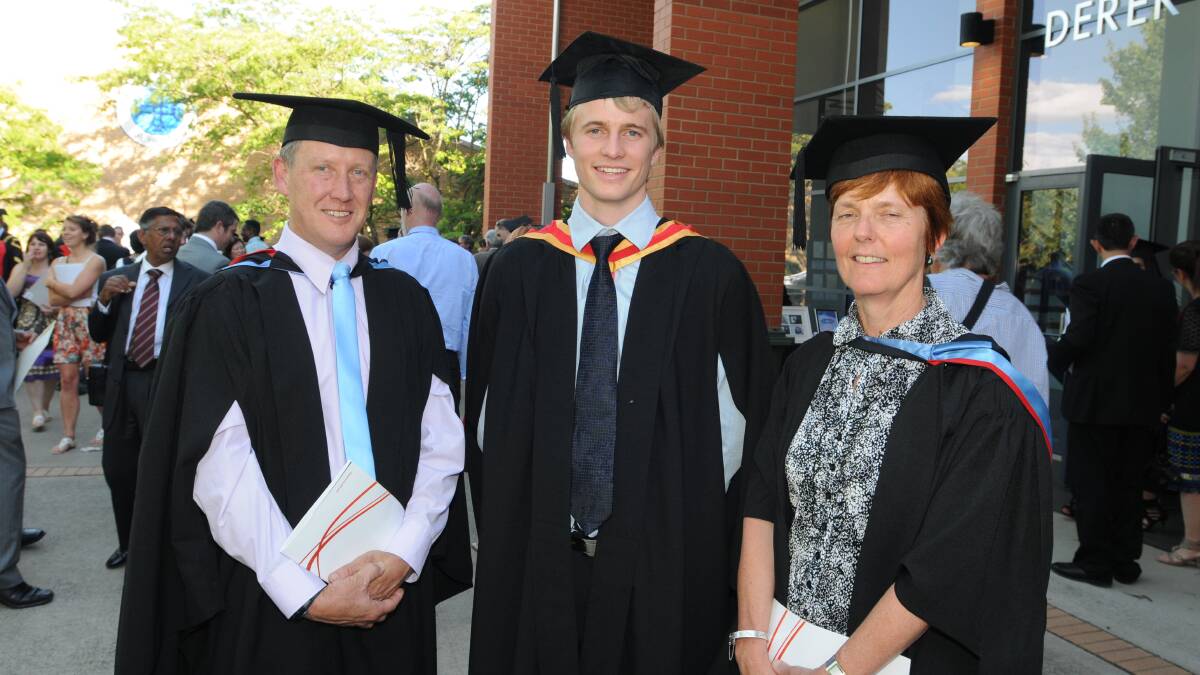 FIRST GRADUATES: Physiotherapy lecturers John Roberts and Kay Skinner with graduate Daniel Luther (centre). Photo: JUDE KEOGH 0216csu33