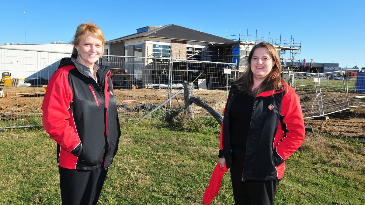 MORE SERVICES: Orange Aboriginal Medical Service administrator of plant and equipment Bronwyn Cooper and practice manager Yolande Meintjes in front of the $4million development now under construction. Photo: JUDE KEOGH 0704oams1
