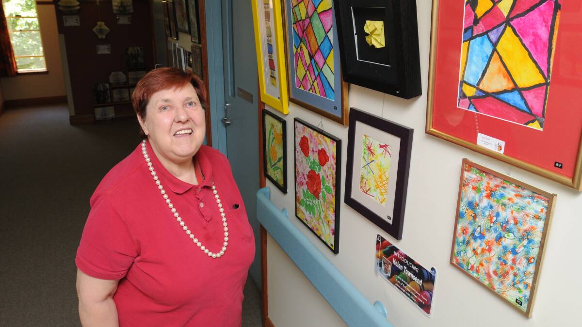 TALENTED SENIORS: Artist and resident of Clancy Weston Lodge Helen Townsend with her artwork, which will be on show this afternoon from 4.30pm. Photo: STEVE GOSCH  1121sgclancyart1
