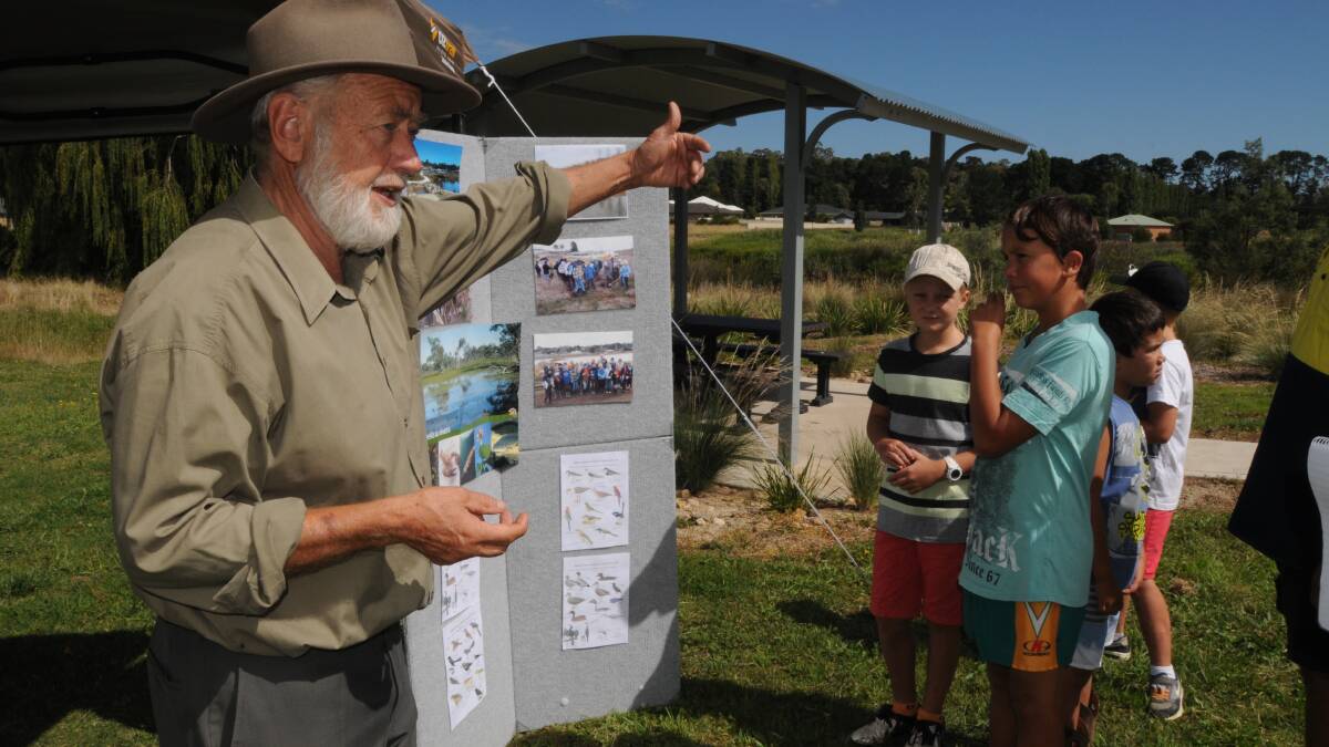 WONDEROUS WETLANDS: : Environmentally Concerned Citizens of Orange president Nick King shows Ryan Percy, Luka Smith, Talby Smith and Tate Percy the varieties of flora and fauna that can be found at the wetlands. Photo: JUDE KEOGH 0207wetlands3