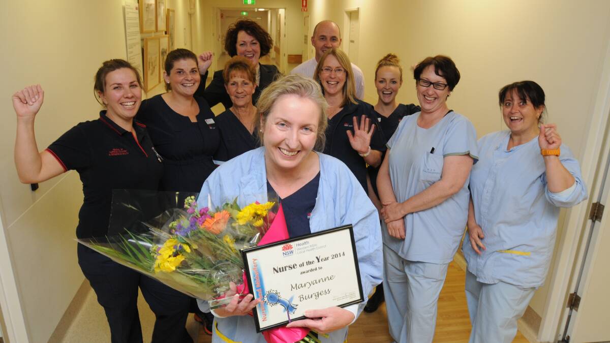TOP GONG: Western Local Health District nurse of the year Maryanne Burgess with her colleagues (from left, middle) Josephine Cunningham, Gemma Pearce, Jenny Sharp, Kath McMaster, Jacqui Haire, Meagan Johnsen, Sandi McAtamney and (back) Meegan Connors and Mark Telford. Photo: STEVE GOSCH 0512nurse
