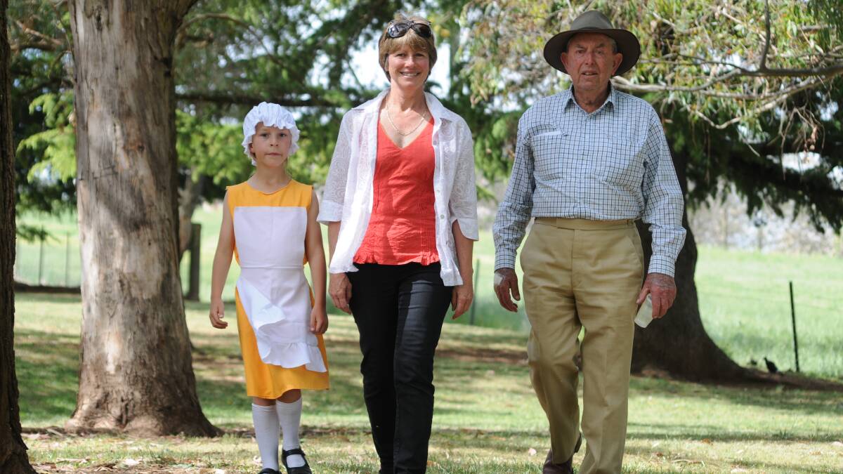 THREE GENERATIONS: Eleanor King, 8, her mother Pam King and grandfather Ross Stanford all attended Canobolas Public School and celebrated its 150th anniversary yesterday. Photo: STEVE GOSCH 1031sgcanob8