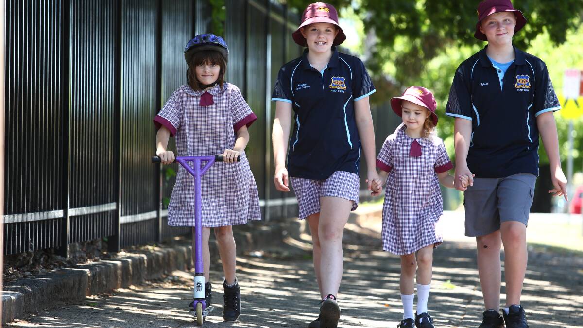 WALK ON: Orange East pupils Leah Madden, Sophie Thornberry, Zahra Barber and Tyhler Rogers walk or ride to school. Photo: PHIL BLATCH 1125walk1