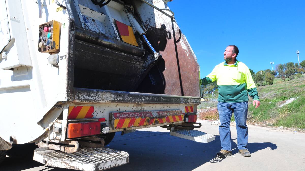 CLEAN-UP TIME: Driver Colin Johnston with one of the trucks being used in next month’s bulky waste clean up. Photo: JUDE KEOGH                        0423cleanup4
