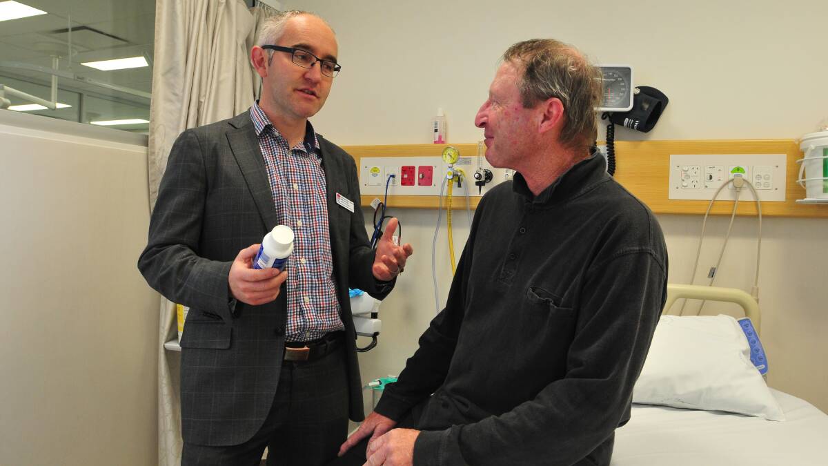 EAGER PARTICIPANTS: Dr Robert Zielinski chats with participant Peter Andreas about the bowel cancer research project set to take place in Orange. Photo: JUDE KEOGH 	0917onctrial1