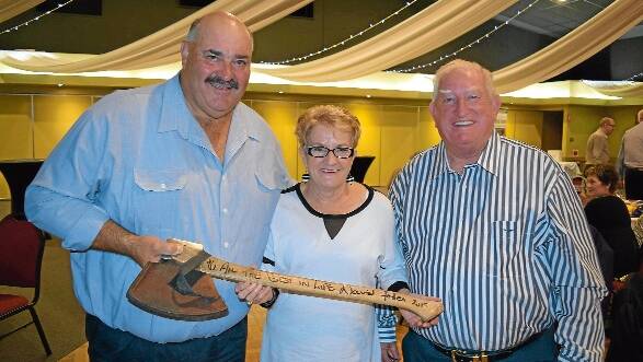 AUCTION PRIZE: Orange mayor  John Davis and his wife Kay took home the  axe donated by champion axeman David Foster for auction. Photo contributed
