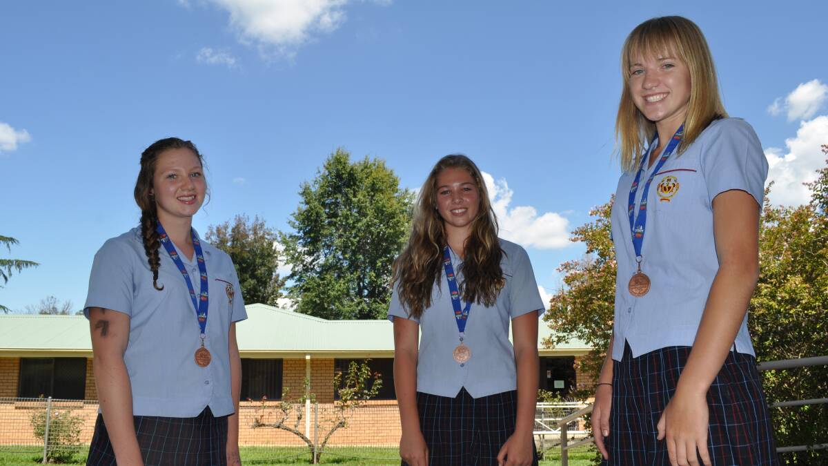 THIRD: Sheahan girls Marnie Lenehan, Tara Nagle and Kinisha Roweth won Combined Catholic Colleges bronze. Photo: NICK McGRATH 0310nmtri3