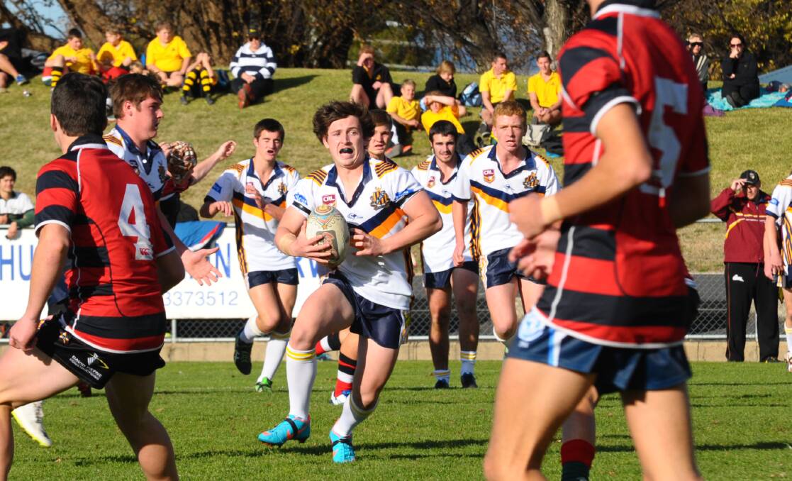 RECOVERY: Tyler Horton in action at Bathurst High School's rugby league match against Dubbo College, before he was critically injured in a tackle.  Photo: ZENIO LAPKA 061214zcup10
