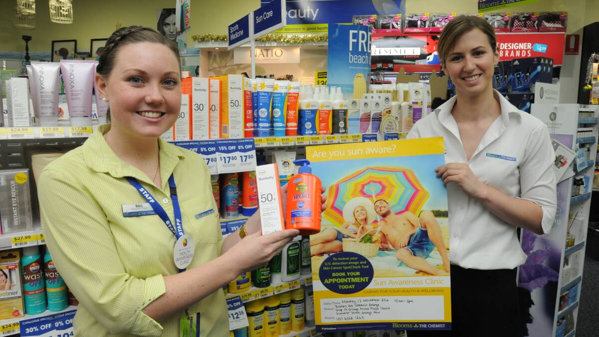 SKIN CHECK: The team at Blooms the Chemist, including pharmacy student Rebecca Clauss and pharmacist Melanie Moses, will offer skin cancer spot checks today. Photo: STEVE GOSCH 1114sgblooms1