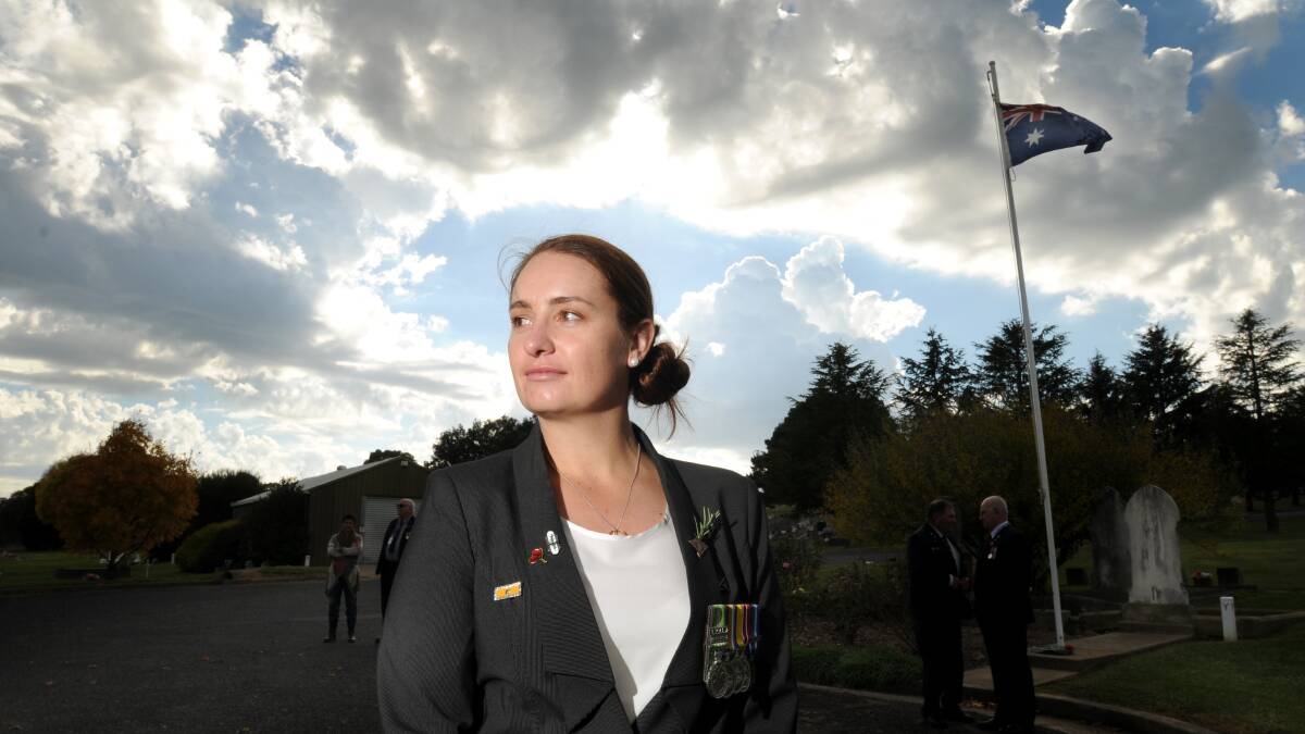 BACK FROM WAR ZONE: After eight years with the 6th and 7th Royal Australian Regiments, serving in Afghanistan and Iraq, Aleasha Clinghan on Friday remembered the mates she lost in the conflicts as she took part in Anzac Day ceremonies. Photo: STEVE GOSCH                                                                                                                                                                   0425sgpilgrimage1
