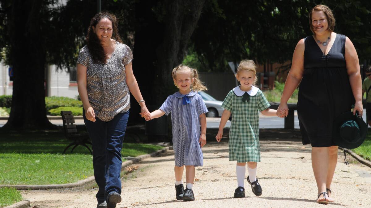 FIRST DAY: Kellie Lalor and daughter Madison Gwynne, and Stacey Ellice and her daughter Hallie are preparing for primary school. Photo: STEVE GOSCH 															    0125sgschool1
