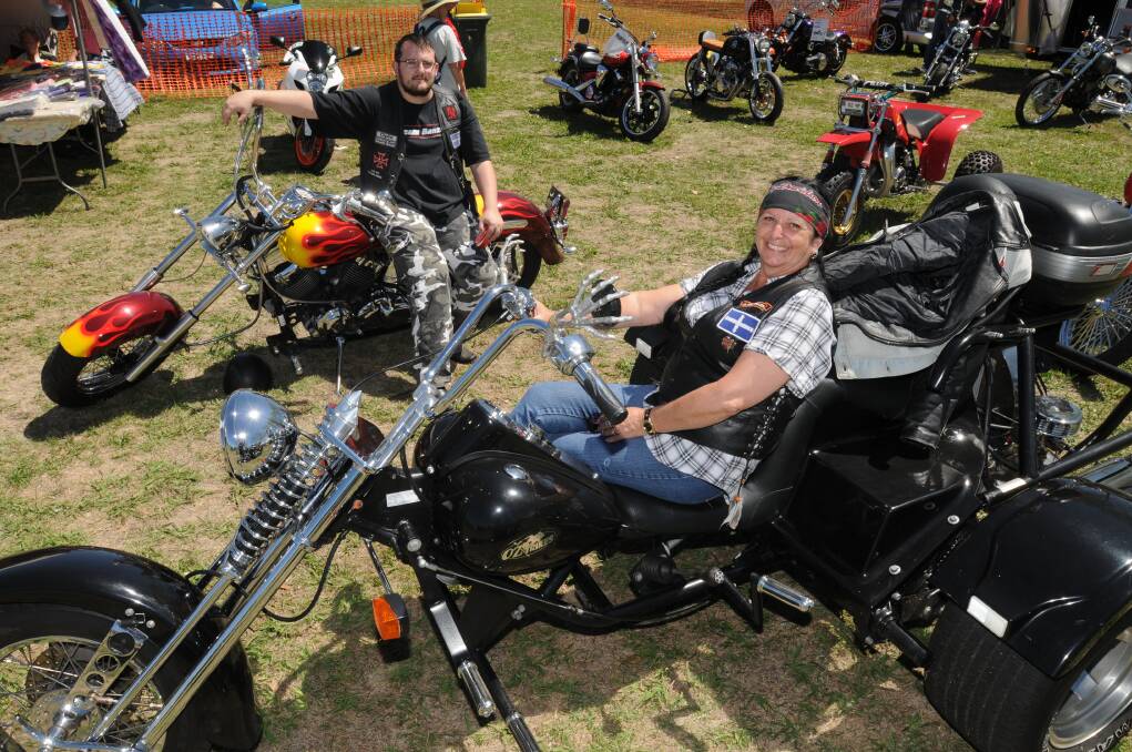 WHEEL DEAL: James Lytton with his Yamaha motorbike and Debbie Lytton with her OZ Trike at the Southern Cross Street Cruisers’ car and bike show at Orange Showground yesterday. Photo: Steve Gosch   0223sgcar1