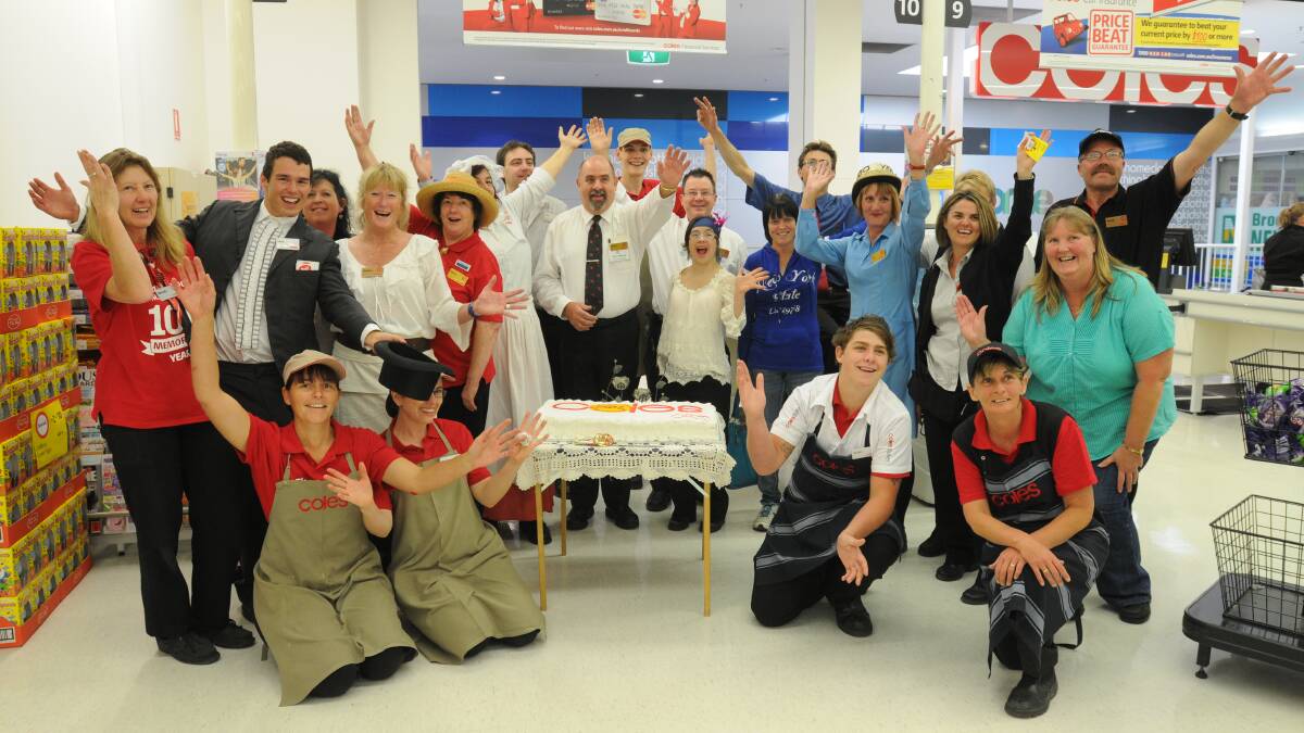 PARTY TIME: Coles staff celebrate 100 years for the chain. Photo: STEVE GOSCH