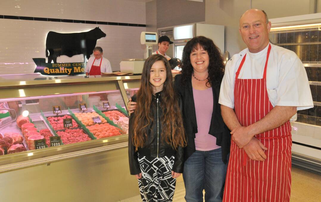 MEET THE BUTCHER: Regular customers Amie and Sherie Coppock with  Summer Centre Quality Meats  owner Scott Munro. Photo: JUDE KEOGH              0725munrobutcher1
