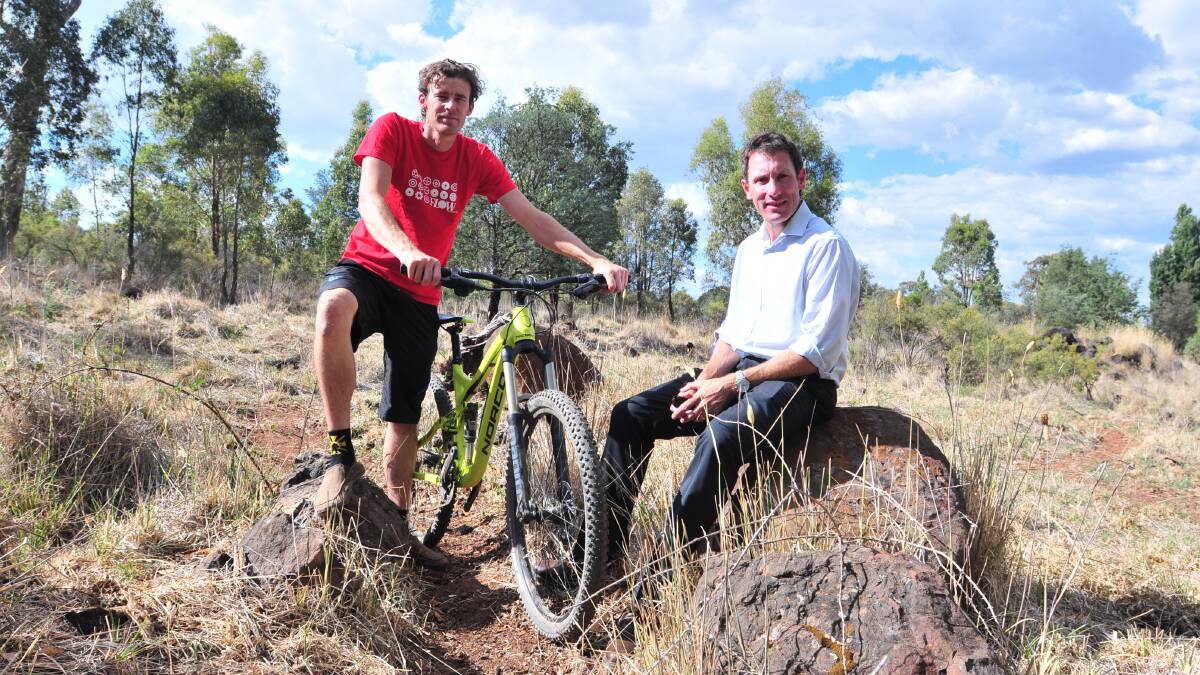 WHEEL DEAL: Central West Off-road Bicycle Club vice president Rodney Farrell and president Scott Charlton believe Mount Canobolas could help cement Orange’s reputation as a mountain biking mecca, building a new industry to help Orange recover when Electrolux closes. Photo: JUDE KEOGH	    0210bikes1
