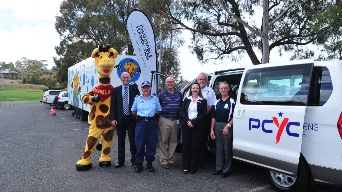 CHARITY BOOST: Healthy Harold with Newcastle Permanent Charitable Foundation executive officer Jason Bourke, senior constable Helen Baker, PCYC region west zone manager Mark Johnson, Newcastle Permanent branch lending manager Erin McVicar, Orange PCYC manager Dave Cleal and president Bobby Bodycott at yesterday's funding grant announcements. Photo: JUDE KEOGH 0307pcyc5