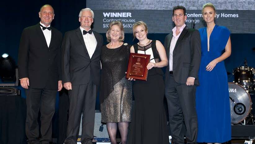 FAMILY AFFAIR: Daniel Kavo from Boral with Contemporary Homes’ Ken Barber, Sue Barber, Kelli Paddison and Michael Paddison and presenter Sylvia Jeffreys. Photo: SUPPLIED