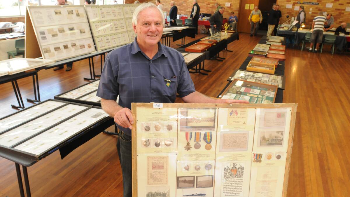 SENTIMENTAL DISPLAY: Orange Coin and Stamp Club president Tony Read with World War I memorabilia he displayed at the annual coin and stamp expo on the weekend. Photo: JUDE KEOGH  0411coins2
