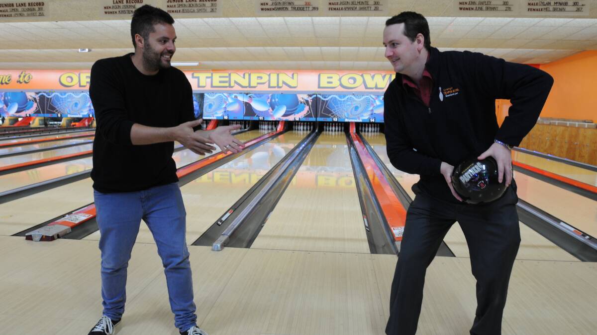 WINNING COMBINATION: Orange Tenpin Bowl’s Jason Belmonte and Jason Brown helped the business win the Central Western Daily’s 2014 Footy Tipping Competition. Photo: STEVE GOSCH 0917sgfooty