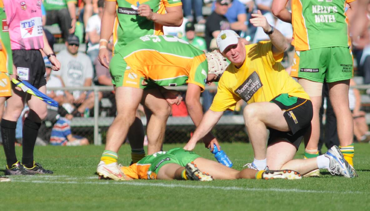 PLAYER PROTECTION: Sports Medicine Australia is urging local football clubs to be scrupulous in the treatment of injuries during finals, particularly head knocks. Photo: STEVE GOSCH 0908sgleague16