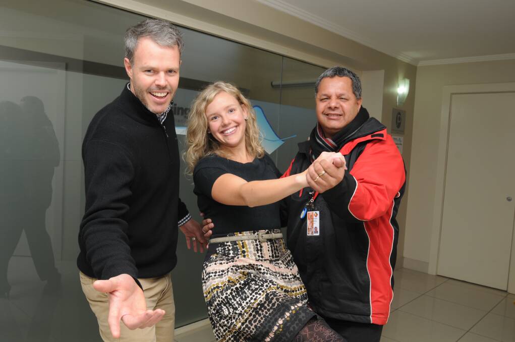 DANCE FOR A CAUSE: Justin Cantelo from Housing Plus, Central Western Daily journalist Danielle Cetinski and Ronny Leonard from Orange Aboriginal Medical Centre will dance up a storm at the Stars of Orange Dance for Cancer later this month. Photo: JUDE KEOGH    0703dancing4
