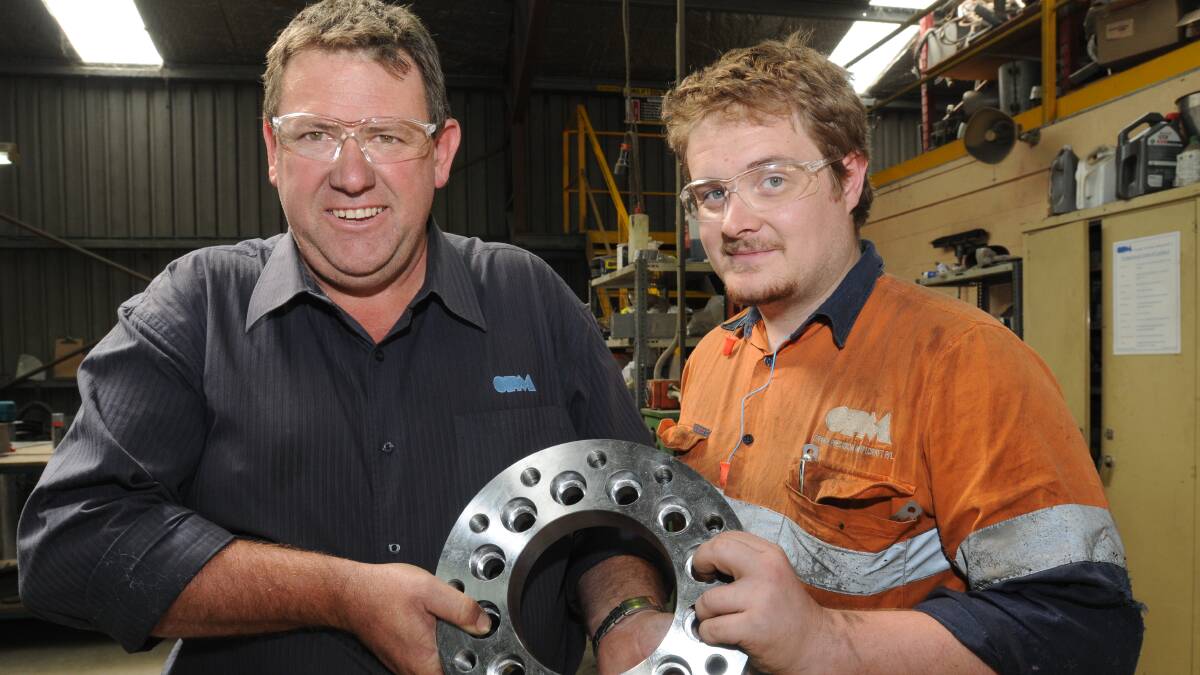 WORKING TOGETHER: Orange Precision Metalcraft fitter and machinist Charles Jones and managing director Mark Thompson are looking forward to next week's jobs expo. Photo: STEVE GOSCH   0311sgexpo1