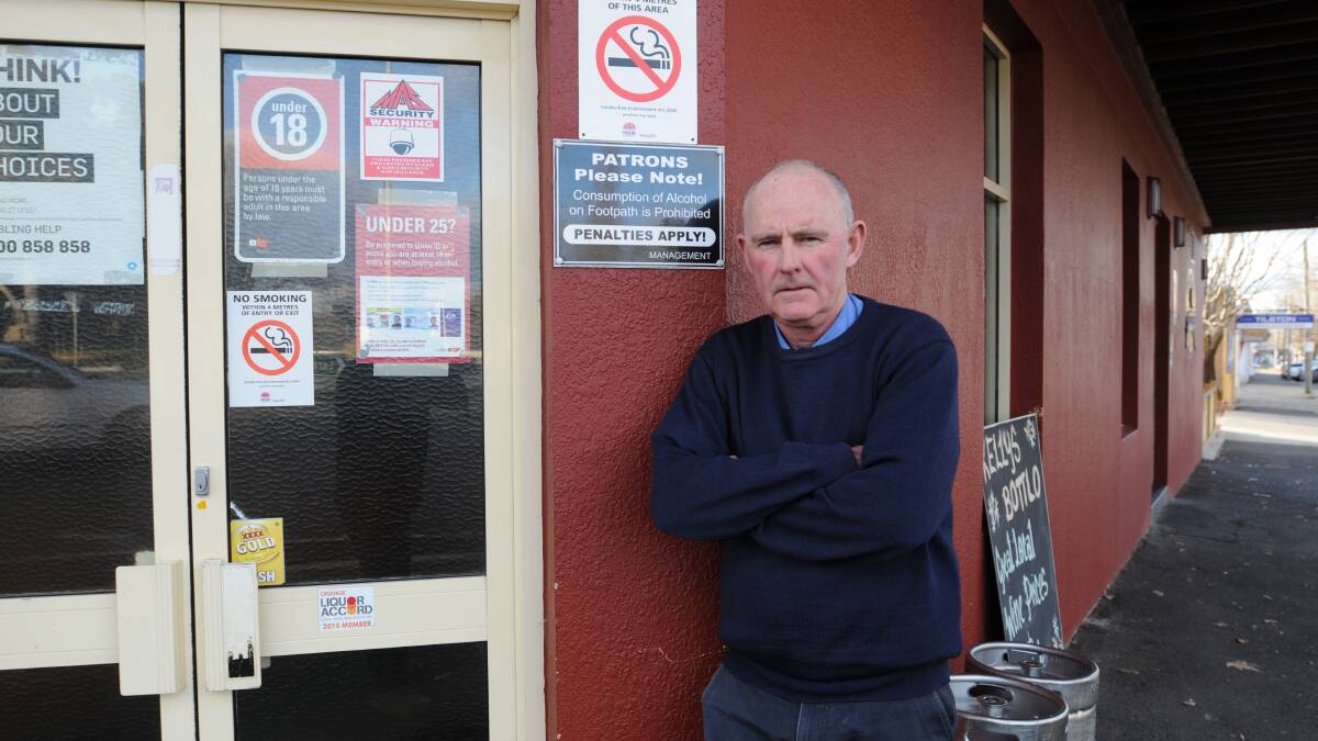 NO SMOKING: Kelly’s Rugby Hotel publican Bill Kelly has put up new signage ahead of changes that came in on Monday banning people from smoking in commercial outdoor dining areas. Photo: STEVE GOSCH 
