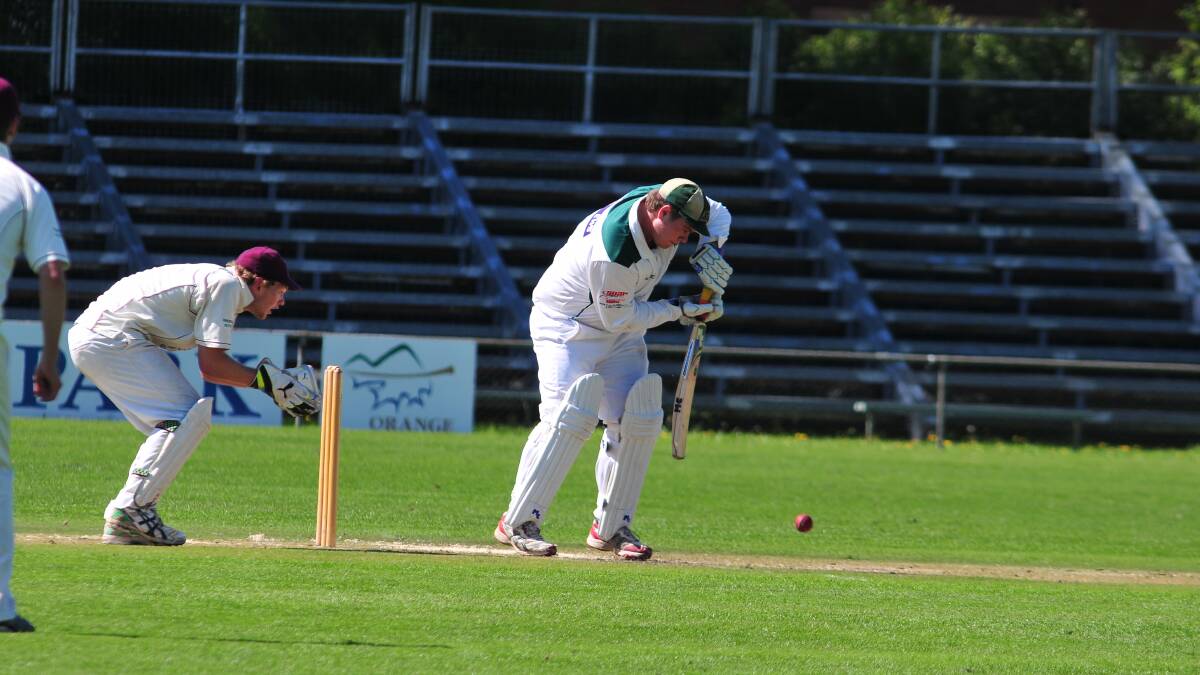 FIRST GRADE: Orange City skipper Matt Findlay defends his wicket in yesterday's play at Wade Park. Photo: JUDE KEOGH
